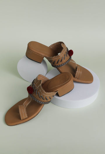 Tan and silver cruelty-free leather heels with pom poms